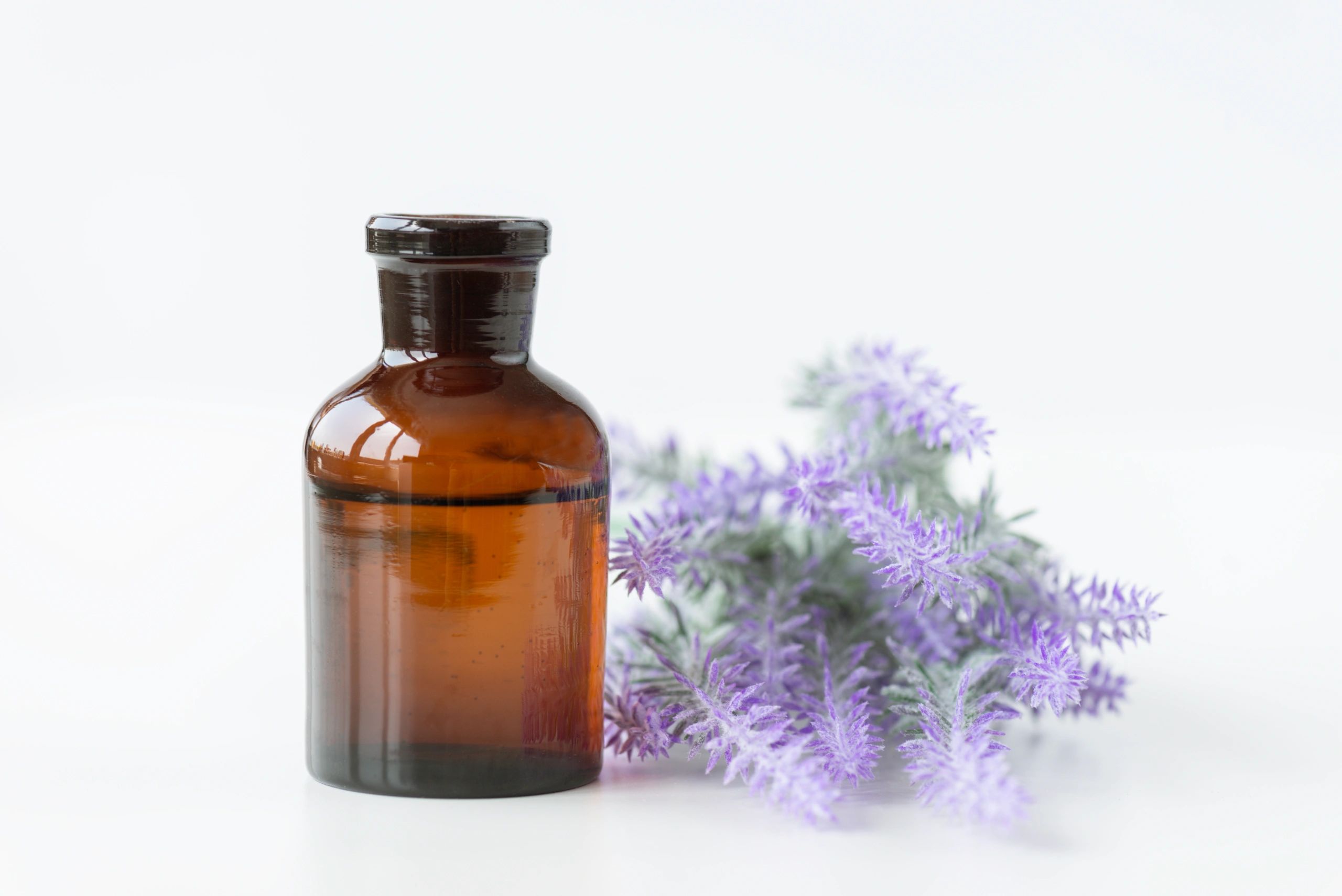 Serum bottle with lavender flowers
