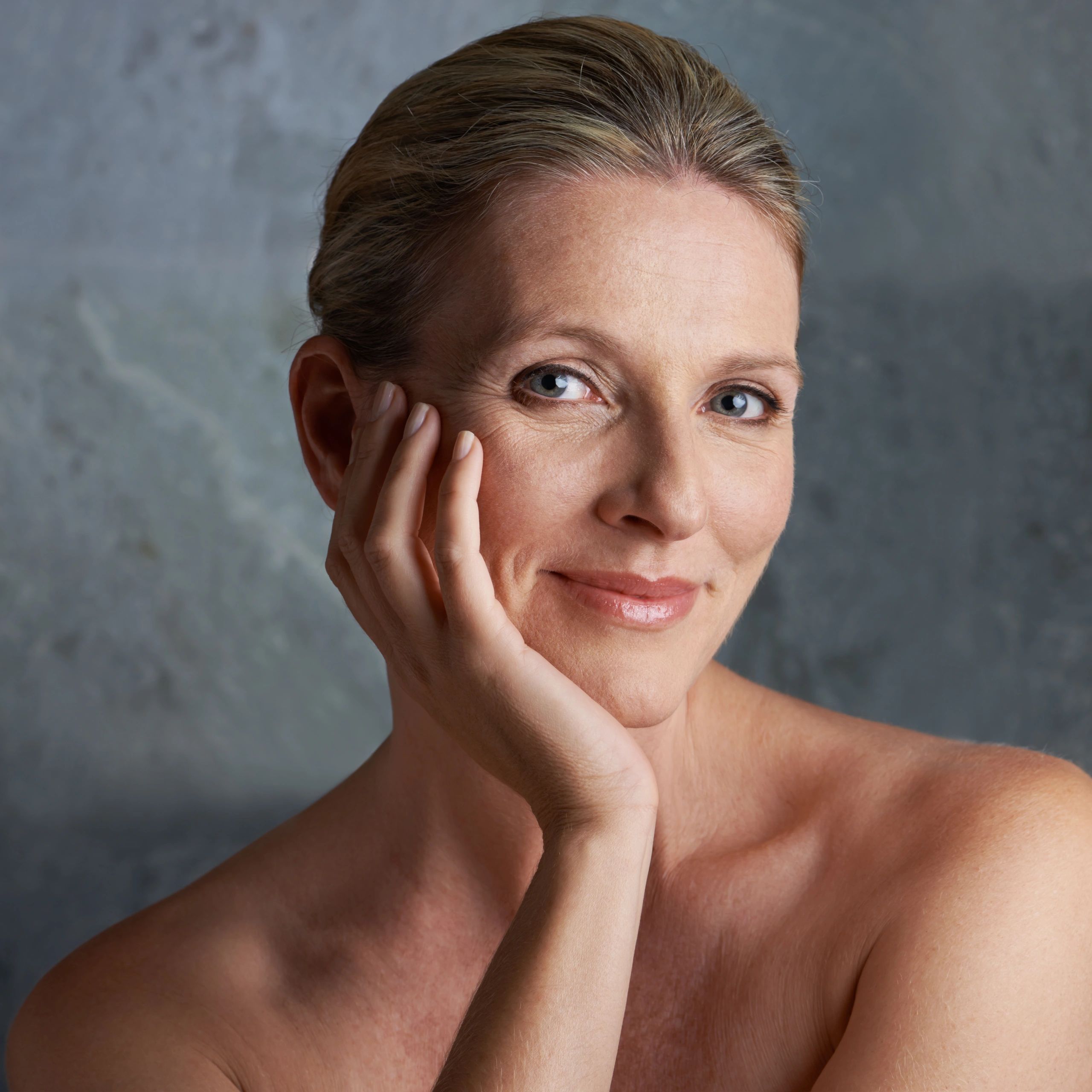 Portrait of a mature woman with bare shoulders